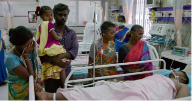 The family of Periyasamy hold vigil the morning after a Russell’s viper bite while Periyasamy was walking home from work.